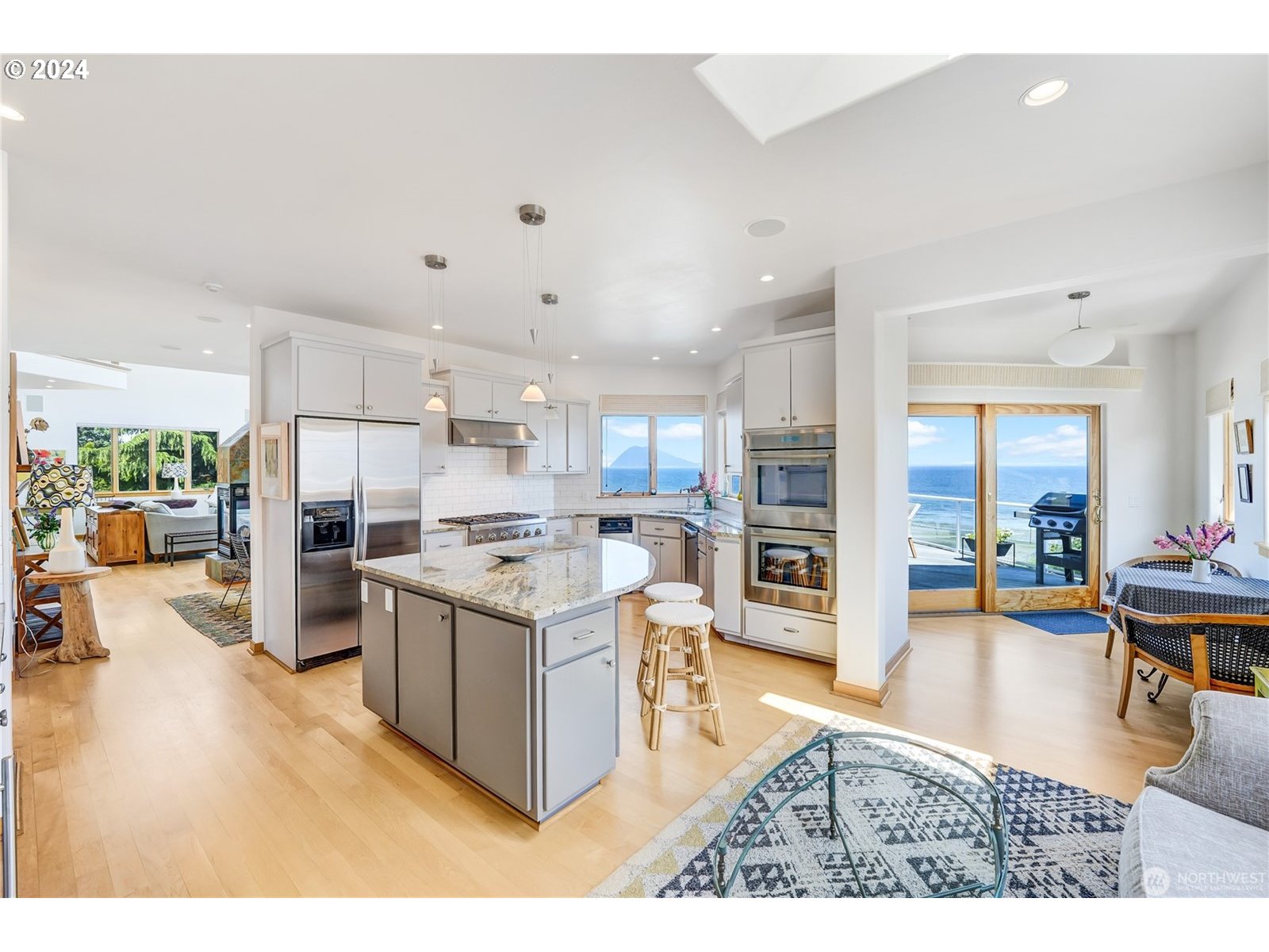 4844 G Loop Bow, WA 98232 - Photo 7 of 40 a kitchen with stainless steel appliances wooden floor and large window