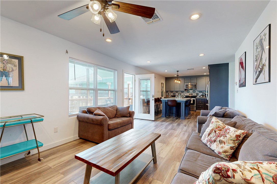 370-374 Copano Ridge Road Rockport, TX 78382 - Photo 27 of 40 a living room with furniture kitchen view and a large window