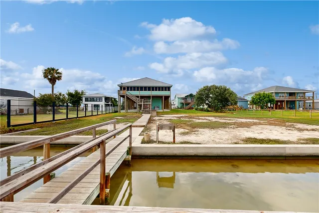 a view of swimming pool with outdoor seating and a yard