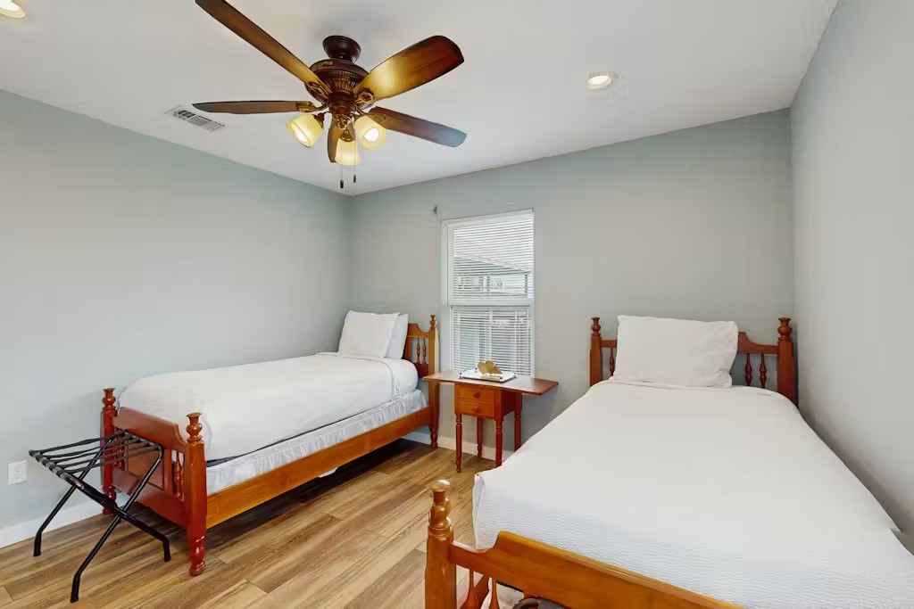 370-374 Copano Ridge Road Rockport, TX 78382 - Photo 34 of 40 a bedroom with a bed and window