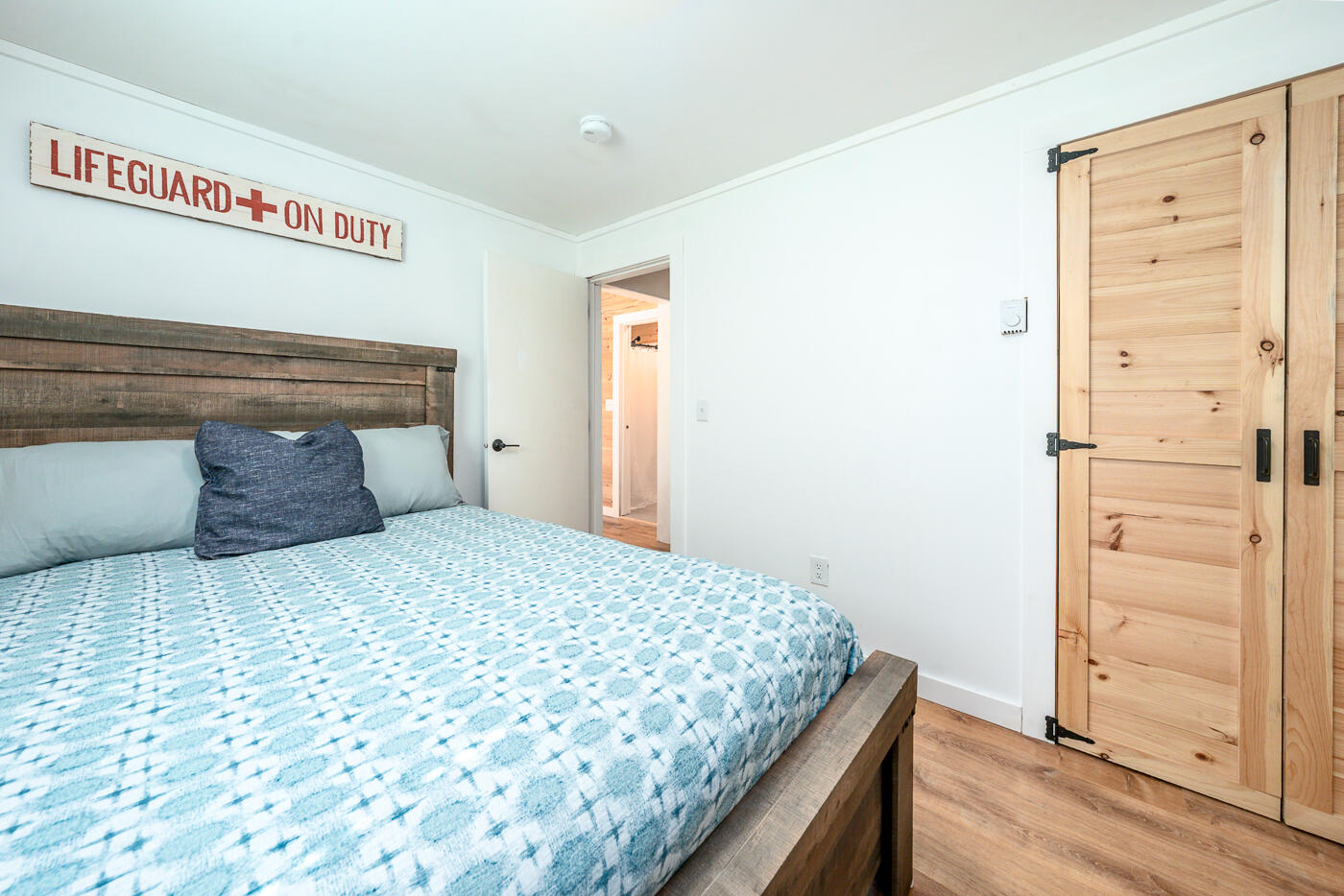 60 Long Avenue, Unit E Wellfleet, MA 02667 - Photo 11 of 18 a bedroom with a bed and cabinets