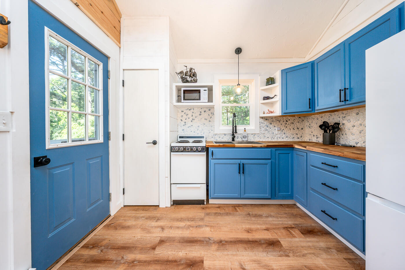 60 Long Avenue, Unit E Wellfleet, MA 02667 - Photo 3 of 18 a kitchen with granite countertop wooden cabinets and stainless steel appliances