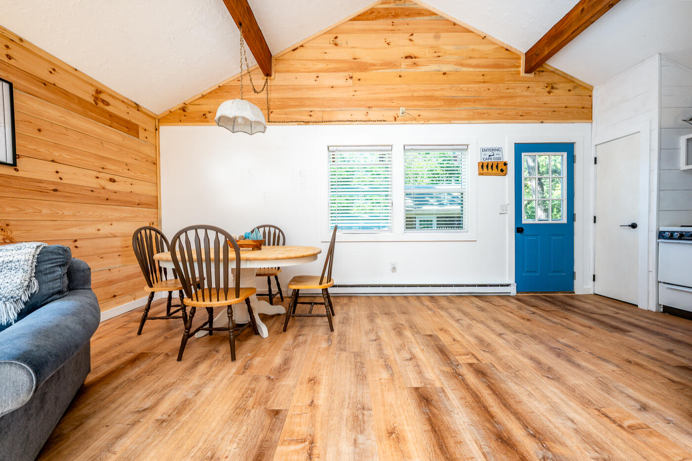 60 Long Avenue, Unit E Wellfleet, MA 02667 - Photo 9 of 18 a view of a dining room with furniture and wooden floor
