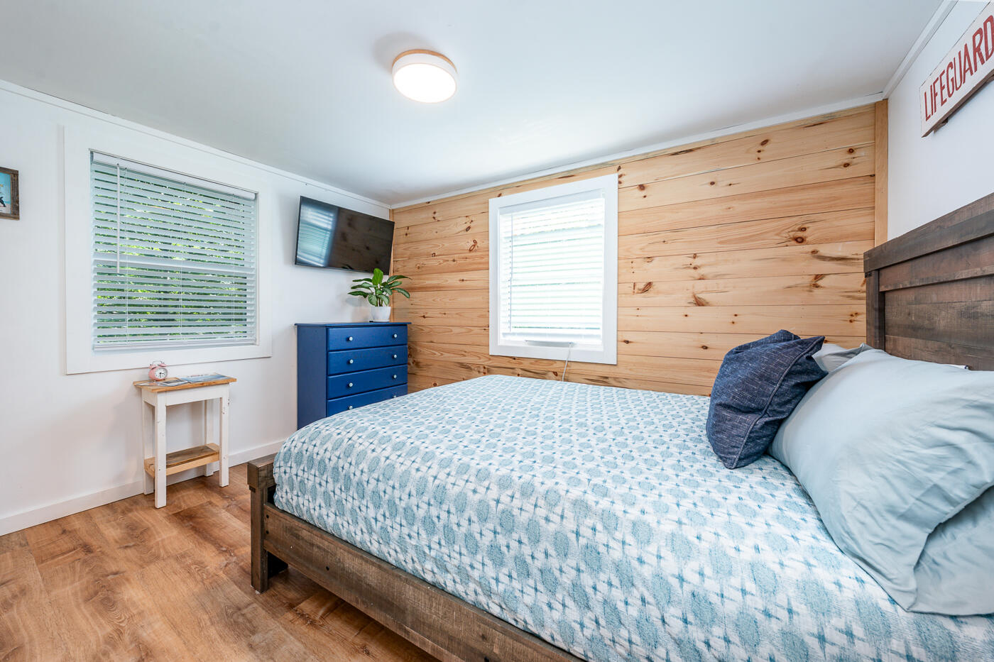 60 Long Avenue, Unit E Wellfleet, MA 02667 - Photo 10 of 18 a bedroom with a bed a table and chair