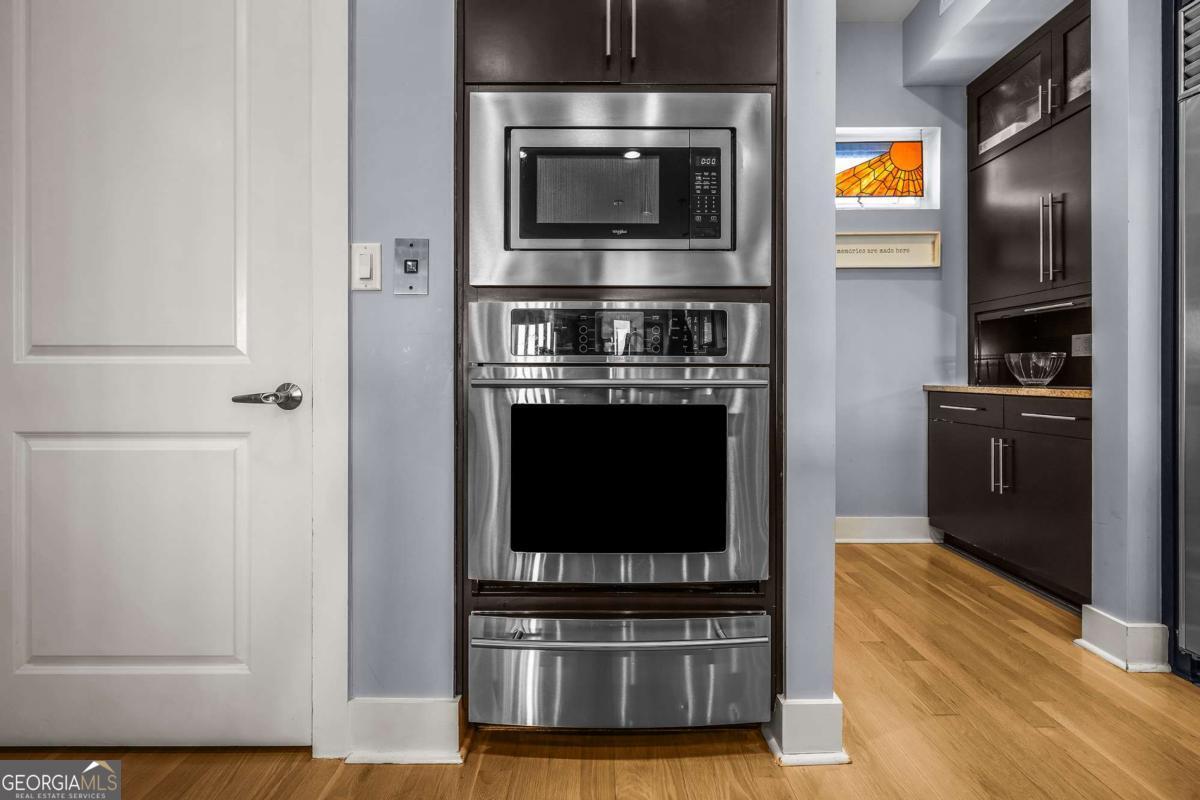 8 18th Street Tybee Island, GA 31328 - Photo 21 of 50 a kitchen with stainless steel appliances a stove and a microwave