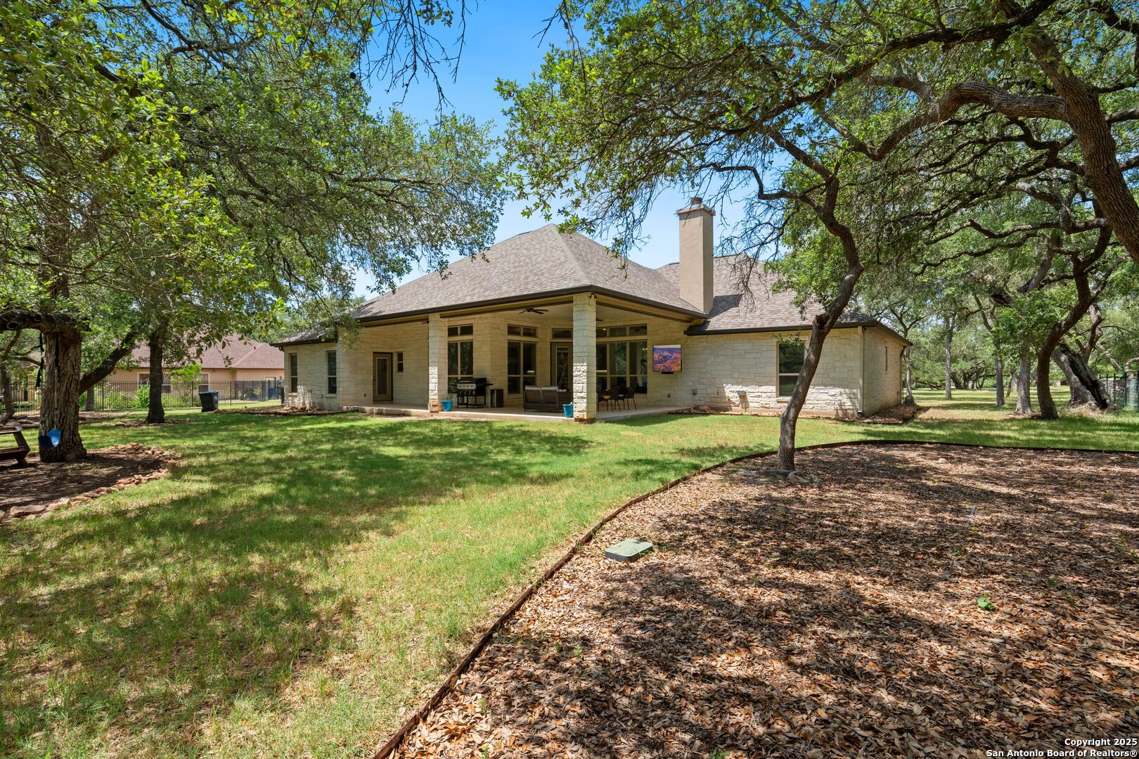 10015 Kopplin Road New Braunfels, TX 78132 - Photo 36 of 38 a front view of a house with a yard