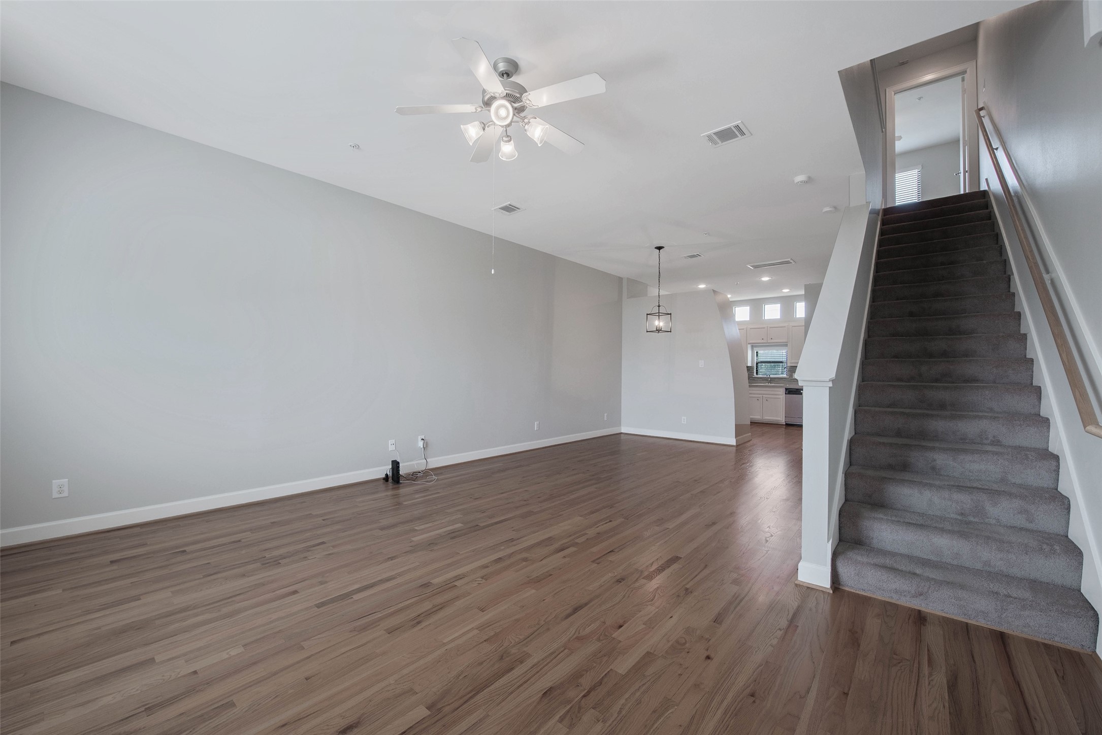 7650 Springhill Street, Unit 603 Houston, TX 77021 - Photo 5 of 26 wooden floor in an empty room with a window