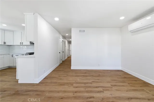 a view of kitchen with wooden floor