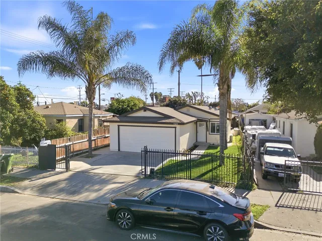 a view of a backyard with a car parked in it