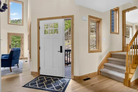 a view of entryway with furniture and a window