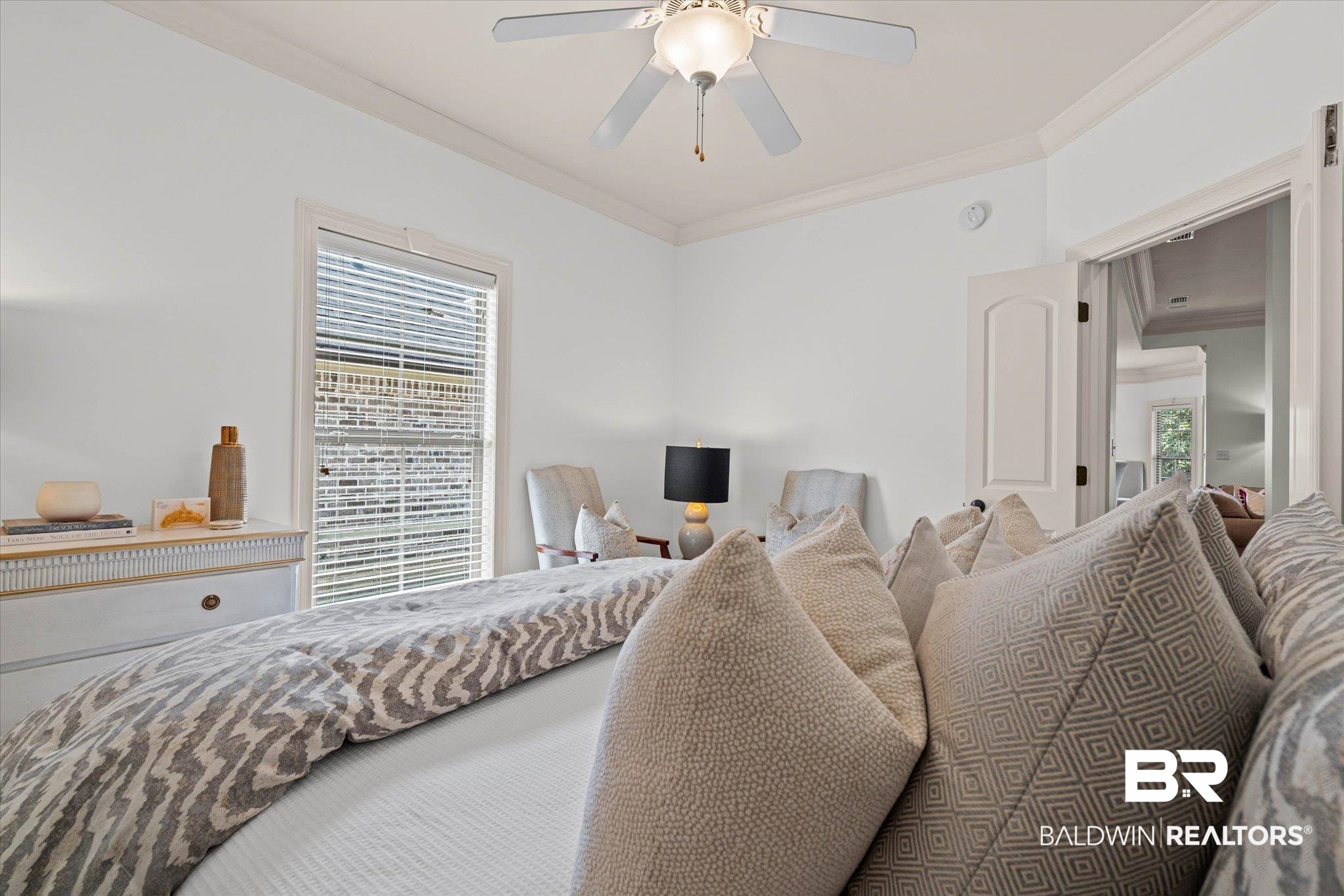 3459 Rue Royal Mobile, AL 36693 - Photo 20 of 31 Bright interior space with a ceiling fan, crown molding, a window with blinds, and a paneled door