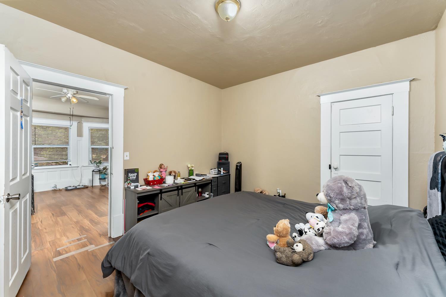 53020 South River Road Clarksburg, CA 95612 - Photo 23 of 42 a bedroom with a bed and a chandelier