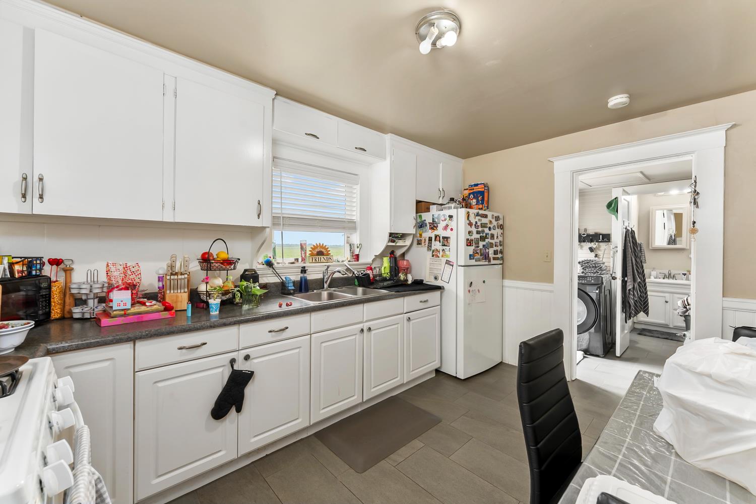 53020 South River Road Clarksburg, CA 95612 - Photo 27 of 42 a kitchen with stainless steel appliances white cabinets and a refrigerator