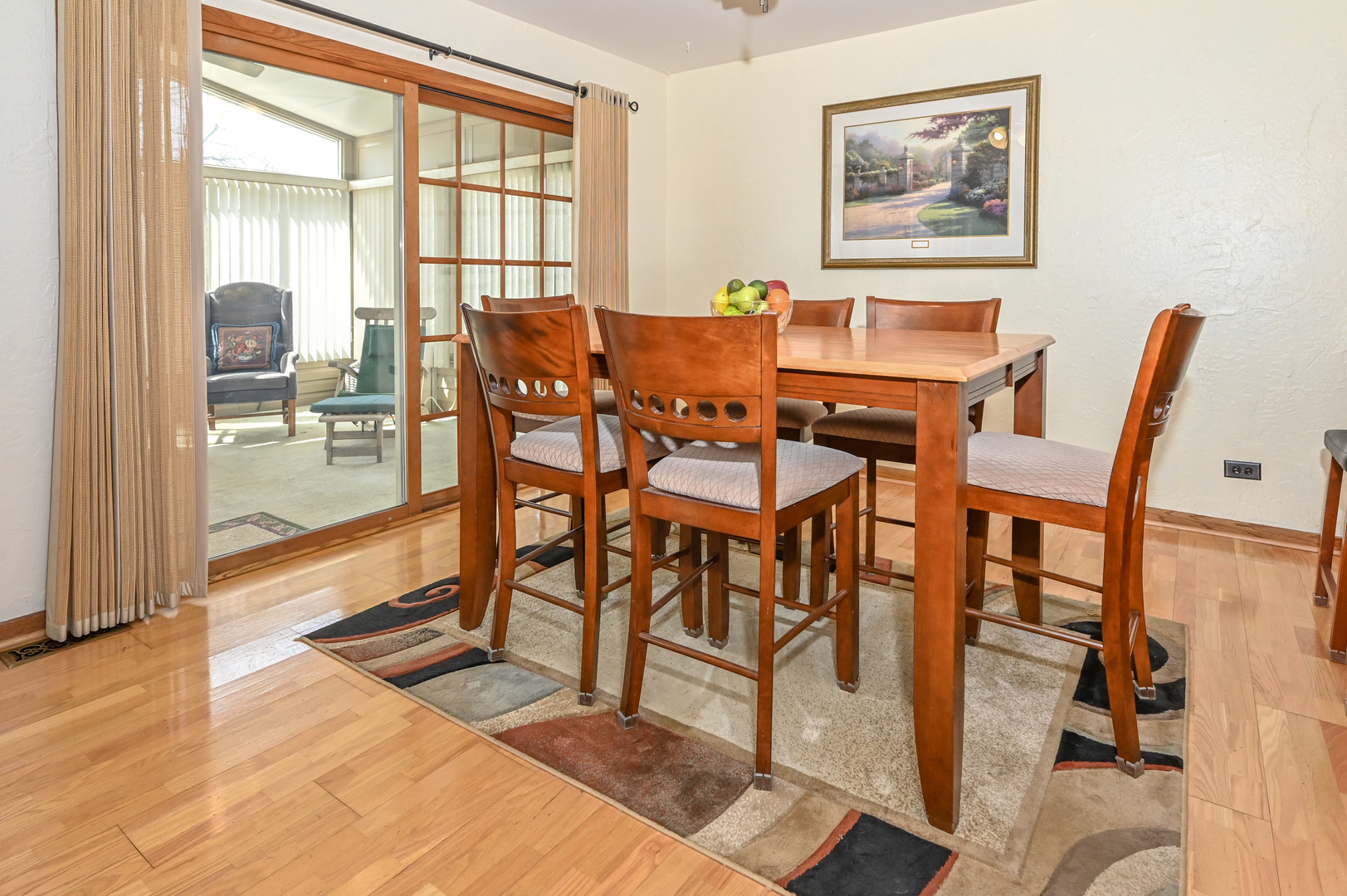 81 Grange Road Elk Grove Village, IL 60007 - Photo 11 of 32 a dining room with wooden floor and glass windows
