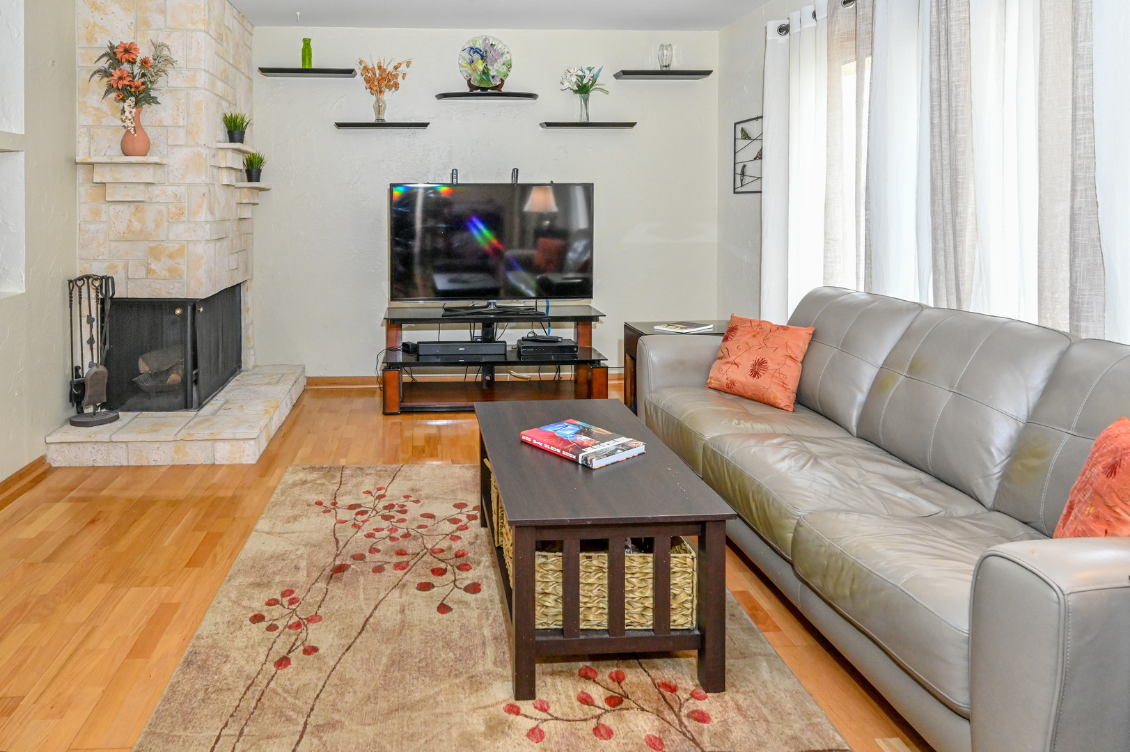 81 Grange Road Elk Grove Village, IL 60007 - Photo 13 of 32 a living room with furniture and a flat screen tv