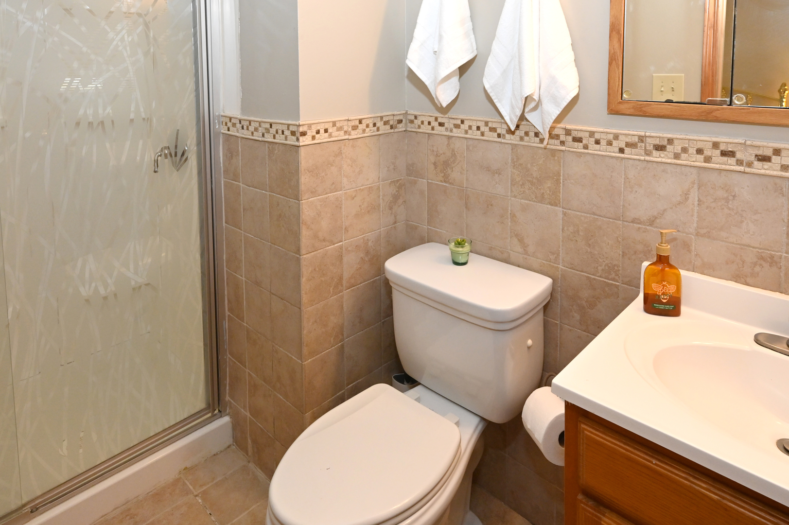 81 Grange Road Elk Grove Village, IL 60007 - Photo 19 of 32 a white toilet sitting next to a bathroom sink