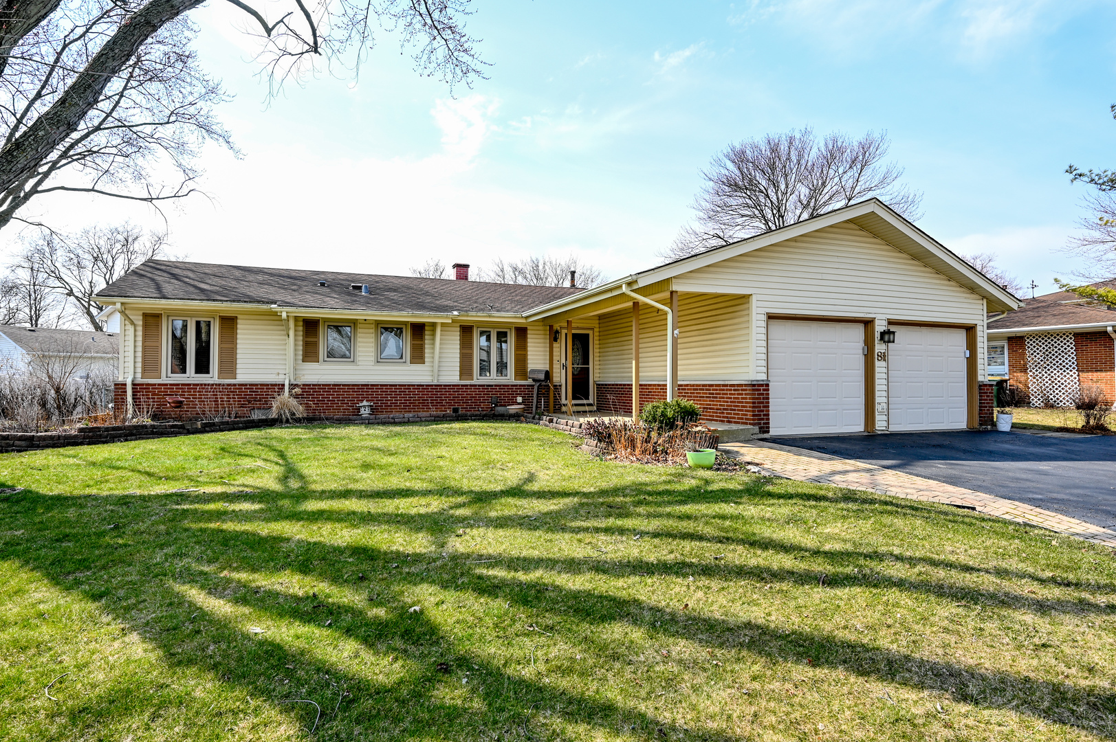 81 Grange Road Elk Grove Village, IL 60007 - Photo 3 of 32 a front view of a house with a garden