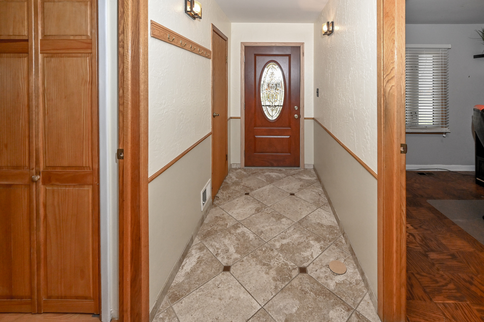 81 Grange Road Elk Grove Village, IL 60007 - Photo 4 of 32 a view of a hallway with wooden floor and entryway