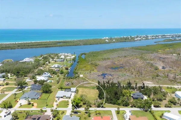 an aerial view of residential building and lake