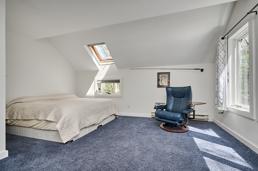 11 Shutesbury Road Leverett, MA 01054 - Photo 15 of 40 a bedroom with a bed furniture and a window