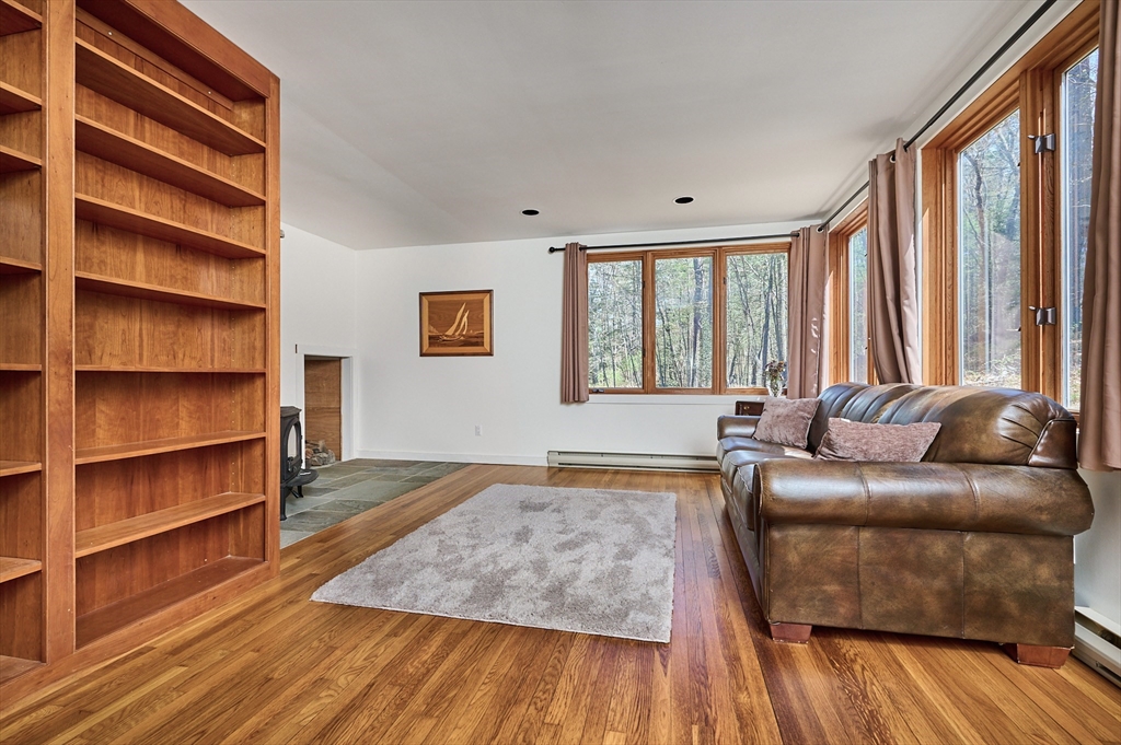 11 Shutesbury Road Leverett, MA 01054 - Photo 20 of 40 a living room with furniture window and wooden floor