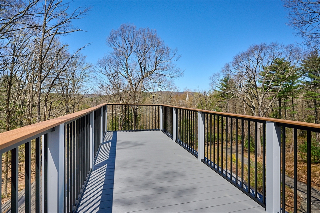 11 Shutesbury Road Leverett, MA 01054 - Photo 28 of 40 a view of a balcony with wooden fence and floor