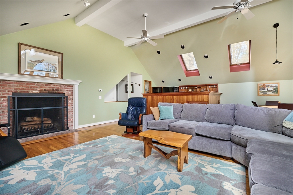 11 Shutesbury Road Leverett, MA 01054 - Photo 5 of 40 a living room with furniture and a fireplace