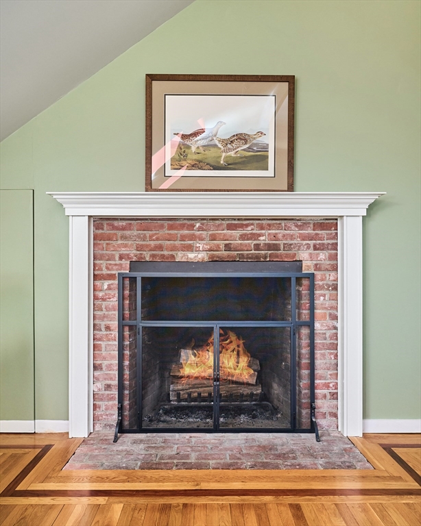 11 Shutesbury Road Leverett, MA 01054 - Photo 7 of 40 a fireplace with a vase on top of it