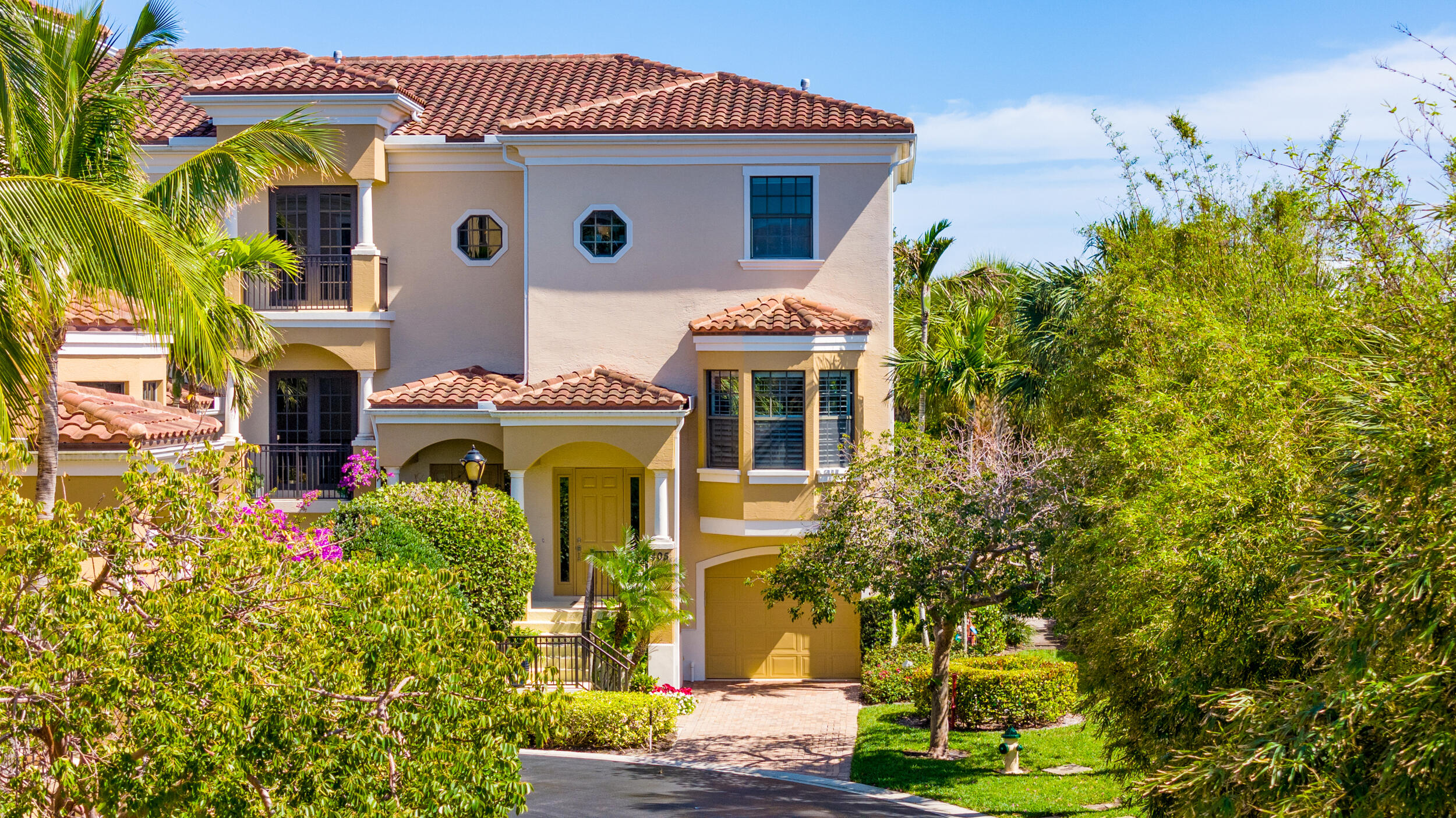 405 Del Sol Circle Tequesta, FL 33469 - Photo 3 of 53 a front view of a house with a yard