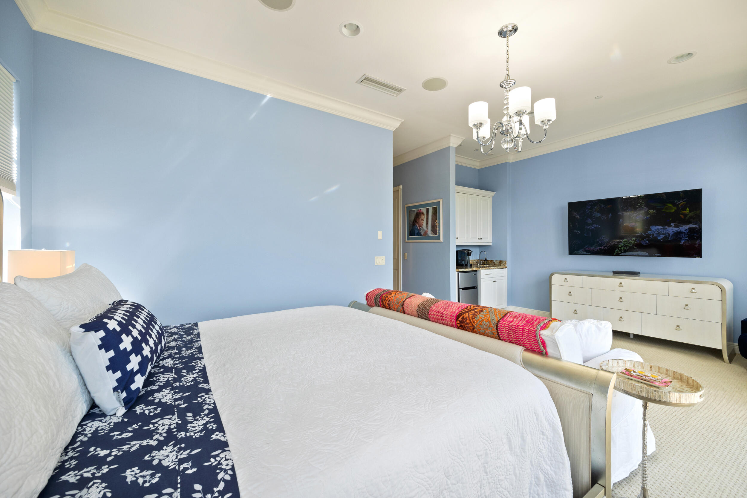 405 Del Sol Circle Tequesta, FL 33469 - Photo 32 of 53 a bedroom with a bed and a flat screen tv