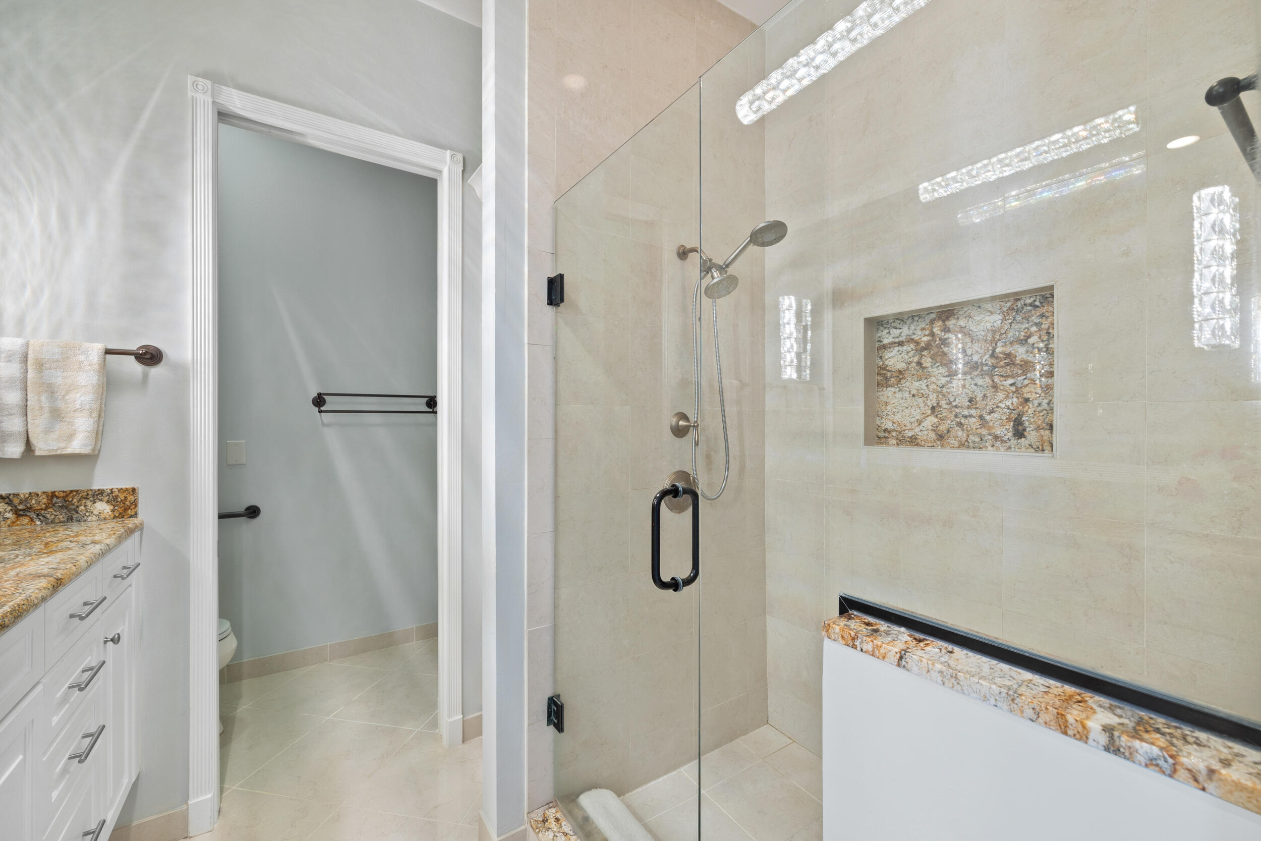 405 Del Sol Circle Tequesta, FL 33469 - Photo 35 of 53 a bathroom with a shower and a sink