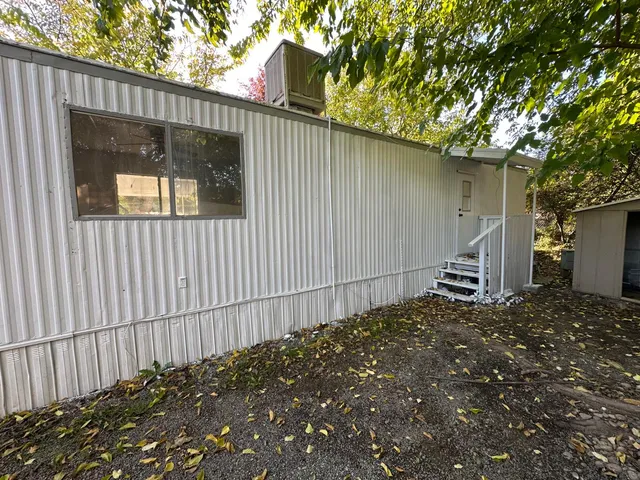 a view of a house with a tree