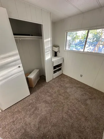 a view of empty room with windows