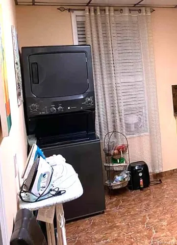 a view of fireplace and two windows