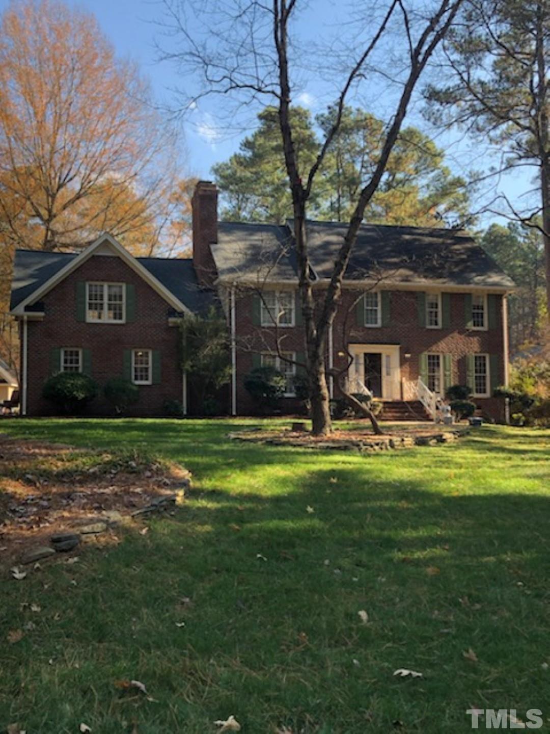9408 Barton Creek Road Raleigh, NC 27615 - Photo 2 of 20 a front view of a house with a garden