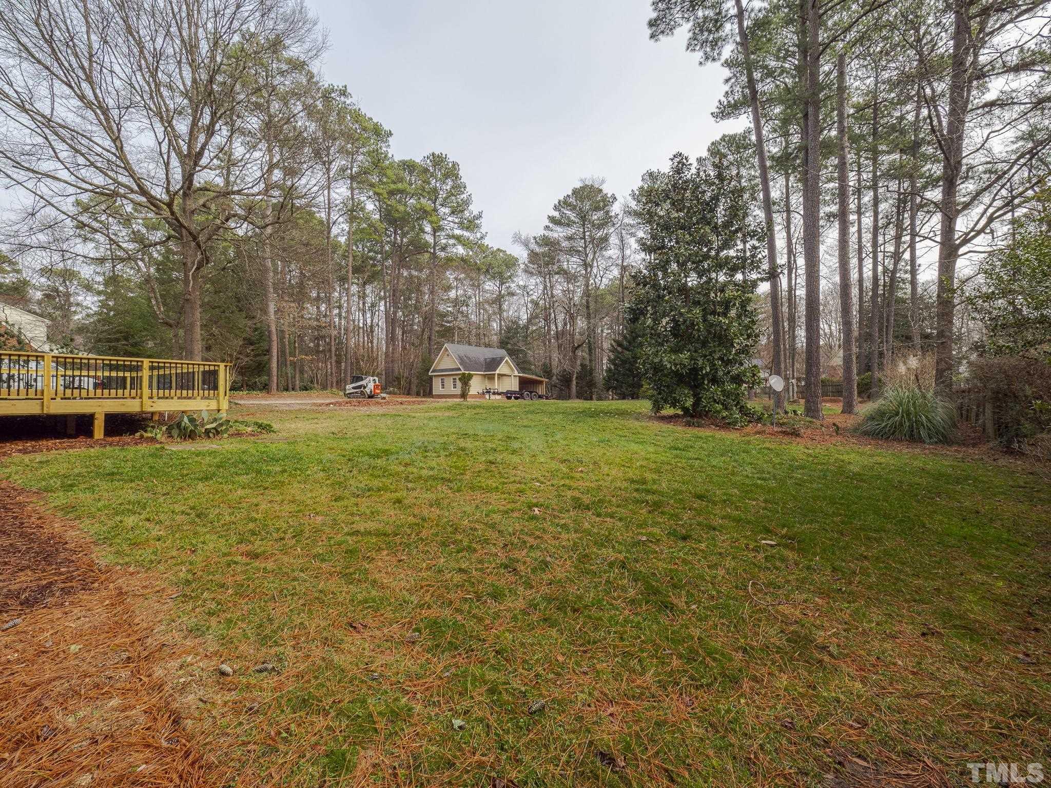 9408 Barton Creek Road Raleigh, NC 27615 - Photo 19 of 20 a view of a park with large trees