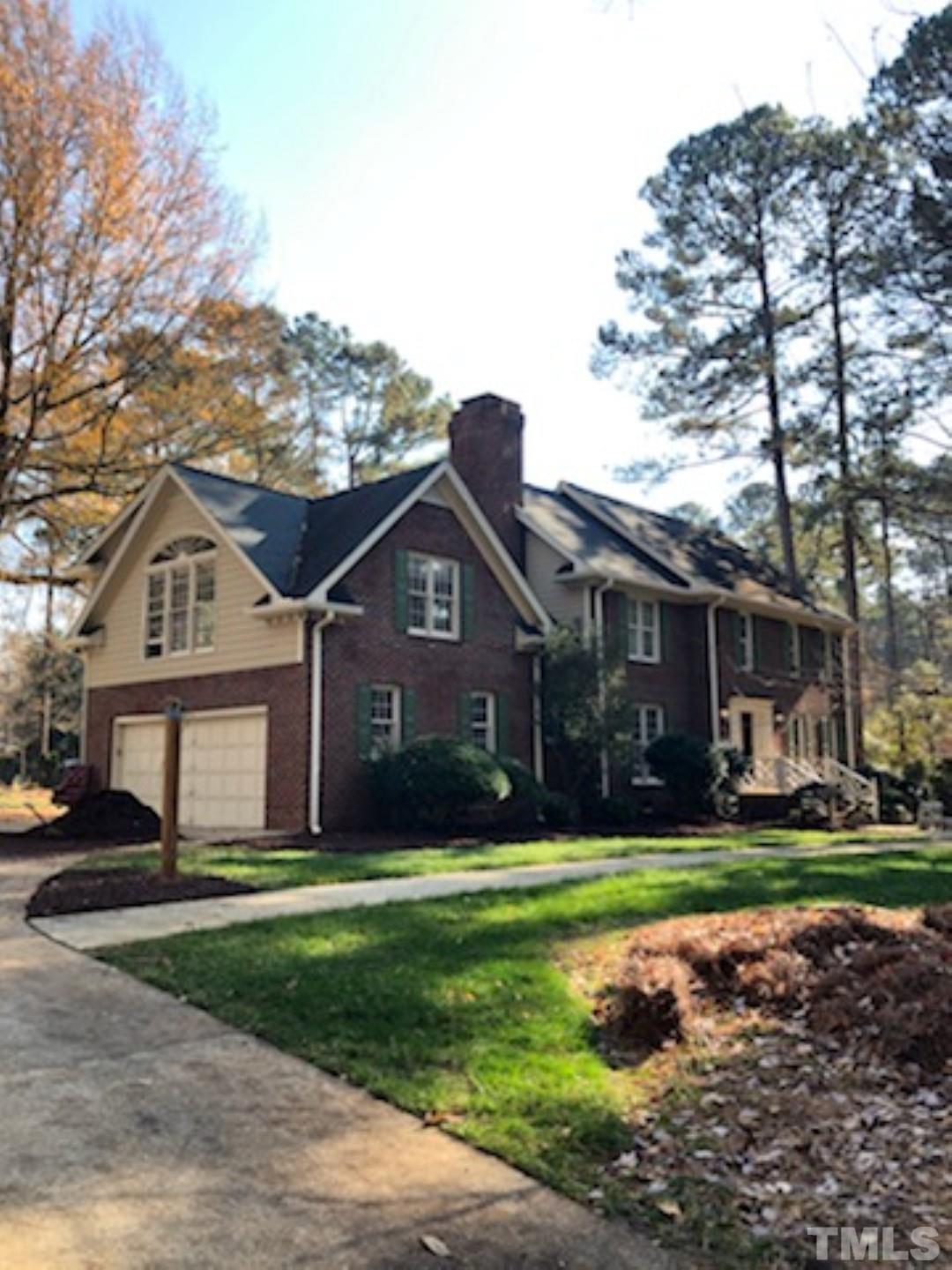 9408 Barton Creek Road Raleigh, NC 27615 - Photo 3 of 20 a front view of a house with a yard