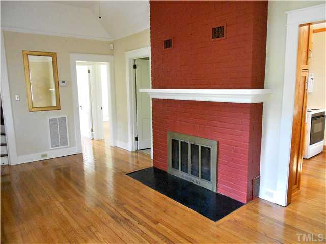 1320 Mordecai Drive Raleigh, NC 27604 - Photo 2 of 22 Living room has a masonry fireplace, hardwoods (throughout most of the main floor), and ten-foot ceilings.