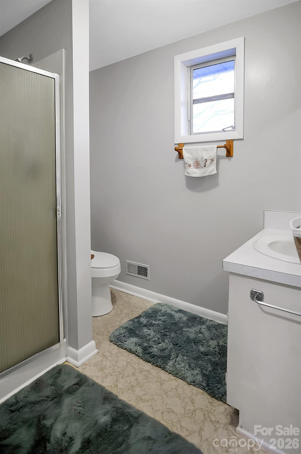 122 Rockman Road Grover, NC 28073 - Photo 30 of 45 a bathroom with a toilet and a sink
