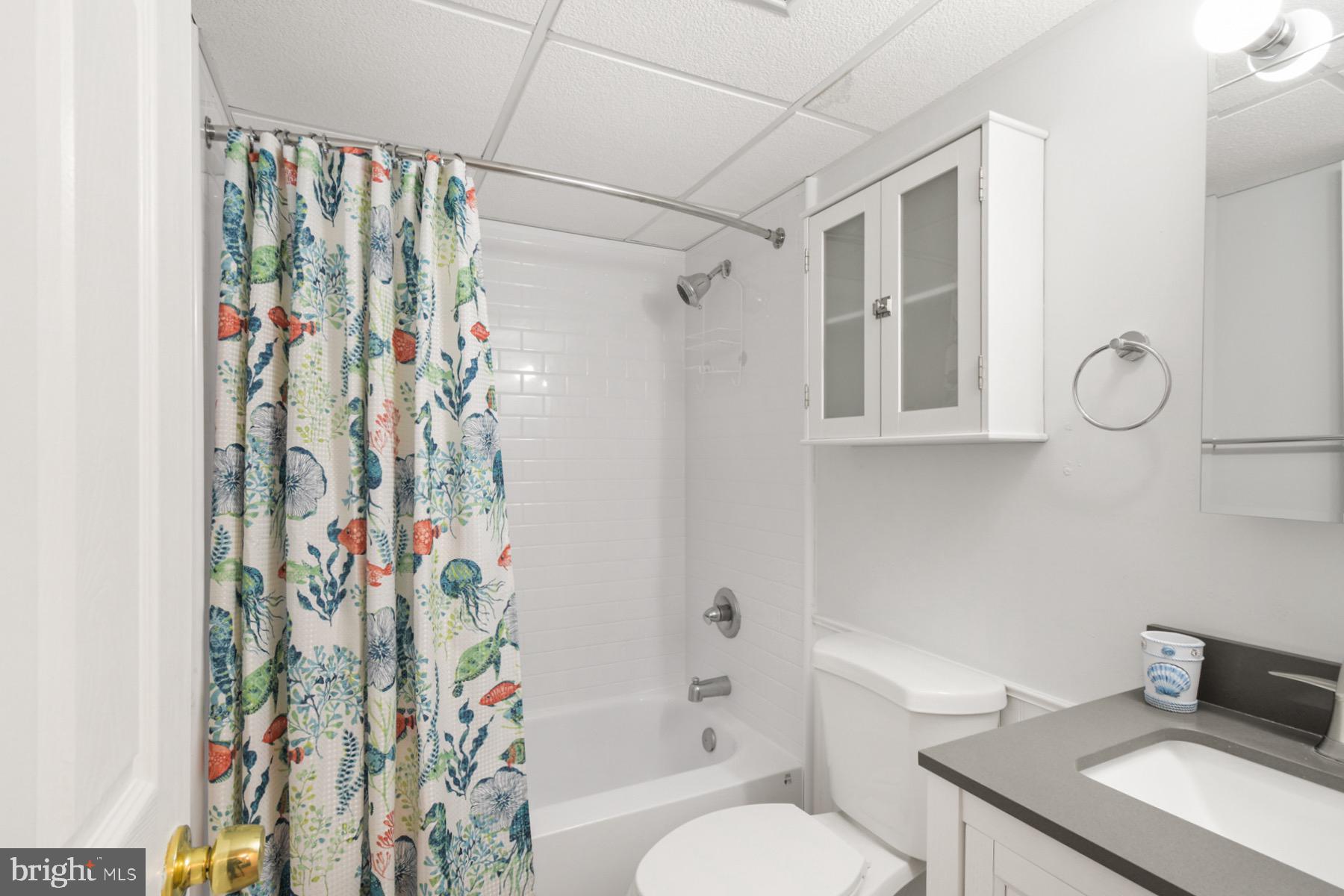 722 Mooring Road, Unit A104 Ocean City, MD 21842 - Photo 24 of 33 a bathroom with a sink toilet and shower