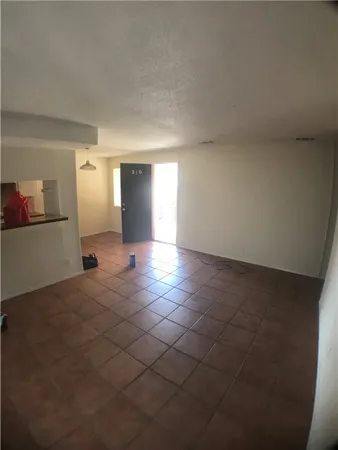 a kitchen that has a sink and a stove