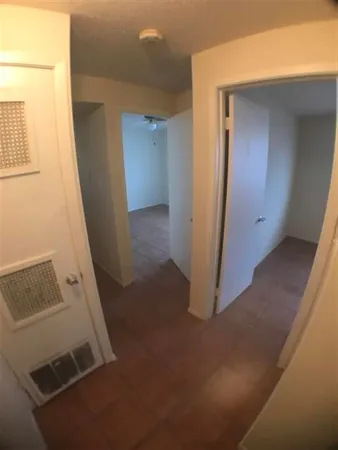 a bathroom with a toilet and a bathtub
