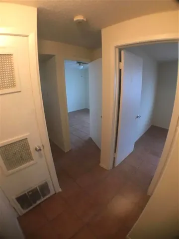 a bathroom with a toilet and a bathtub