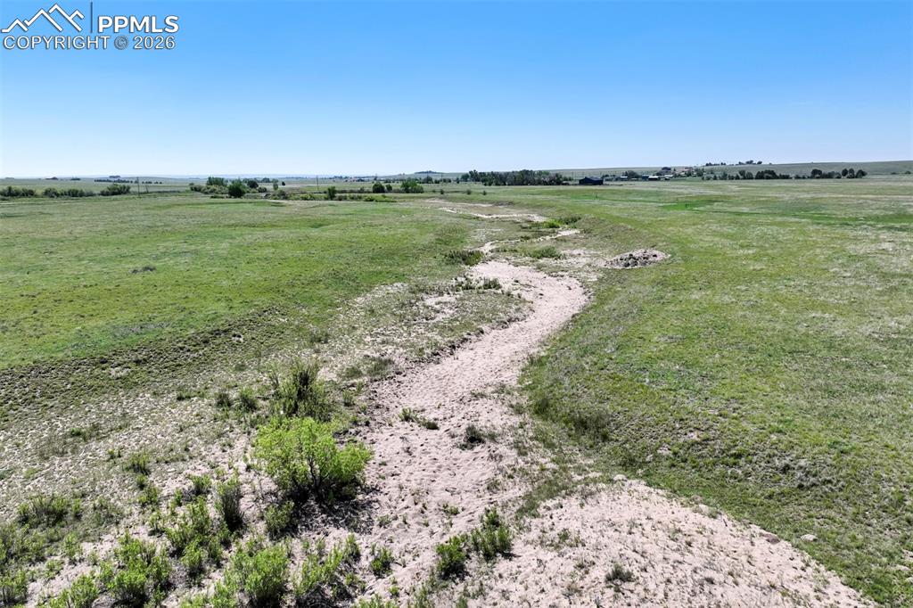 Slocum Road Peyton, CO 80831 - Photo 2 of 2 a view of a lake with a mountain in the back