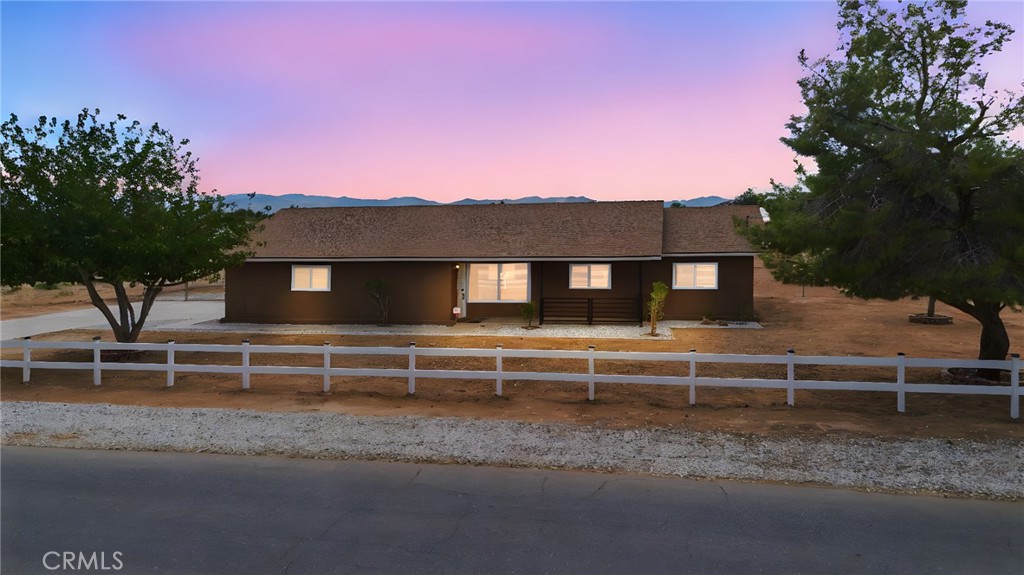 20631 Zuni Road Apple Valley, CA 92307 - Photo 1 of 25 a view of house with a yard