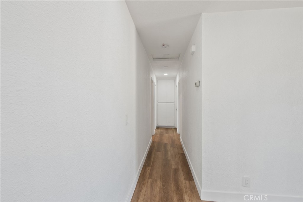20631 Zuni Road Apple Valley, CA 92307 - Photo 13 of 25 a view of a hallway with a door