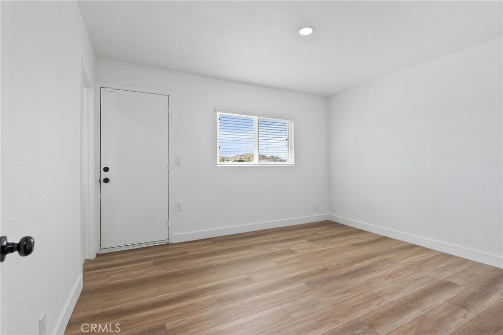 20631 Zuni Road Apple Valley, CA 92307 - Photo 16 of 25 wooden floor in an empty room