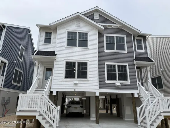 a front view of a house with many windows