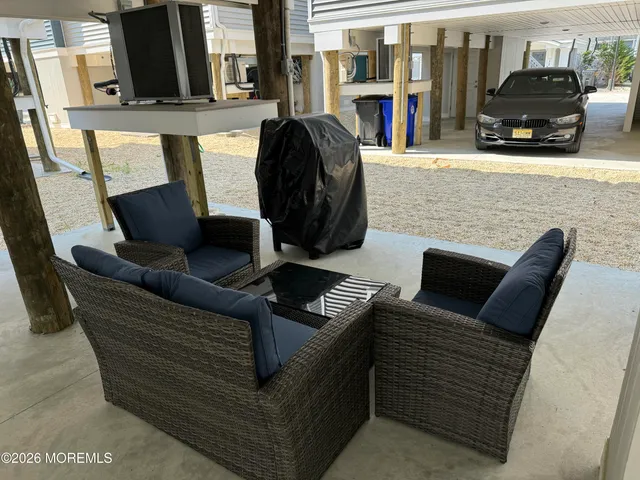 a view of a water with a large tree