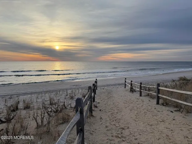 a view of a lake with outdoor seating